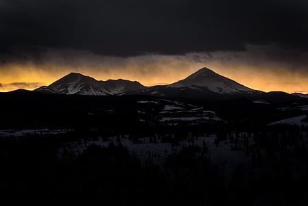 snow covered mountain under white cloudy sky thumbnail