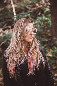 woman wearing black leather jacket standing outside thumbnail