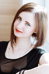 woman in black lace scoop-neck cap-seeve shirt closeup photo thumbnail