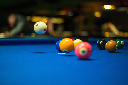 selective focus photo of cue balls on billiard table thumbnail