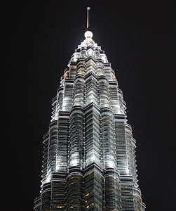 gray concrete tower under night sky thumbnail