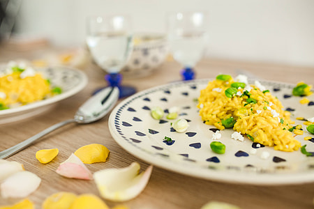 Risotto with broad bean on a cute plate with blue hearts thumbnail