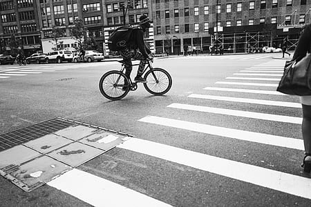 man riding bicycle on road thumbnail