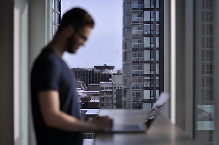 man using laptop on top of table thumbnail