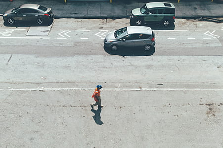 person walking on gray concrete pavement thumbnail