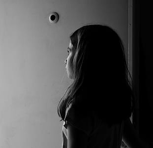 Grayscale Photography of Girl Near Wall thumbnail