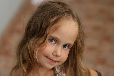 closeup photography of girl wearing white top thumbnail