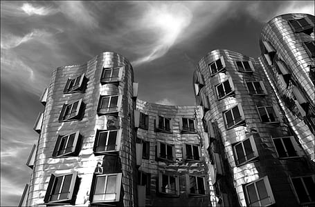 building under gray clouds thumbnail
