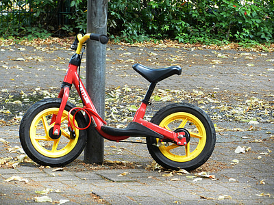 red and black balance bike thumbnail