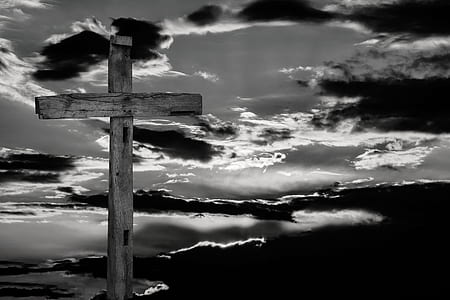 cross under cloudy sky thumbnail