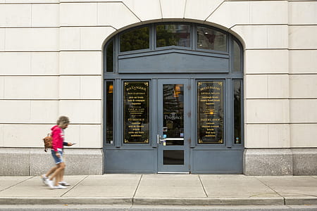 two persons walking near grey framed glass door thumbnail