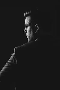 man wearing black coat thumbnail