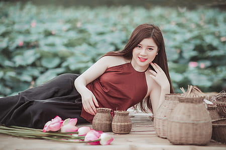 Woman Lying on Floor Near Baskets thumbnail
