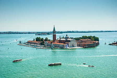 brown and white lighthouse in body of water thumbnail