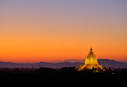 golden tower under orange sky thumbnail