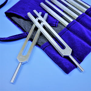 five gray metal handheld tools on blue textile thumbnail