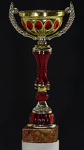 red and gold-colored trophy thumbnail