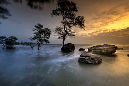 time-lapse photography of rocks and body of water thumbnail