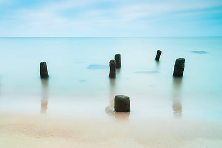 six black rock formation photo during daytime thumbnail