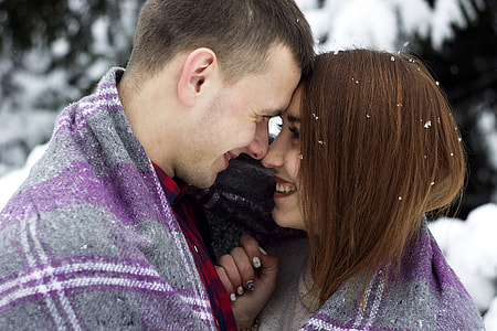 Cute Couple Kissing in the Snow thumbnail