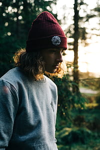 shallow focus photography of person wearing red knit hat thumbnail