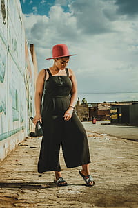 woman standing on beige pavement thumbnail