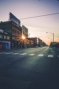 open road during sunrise thumbnail