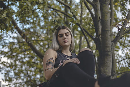 Woman Sitting Near Tree thumbnail