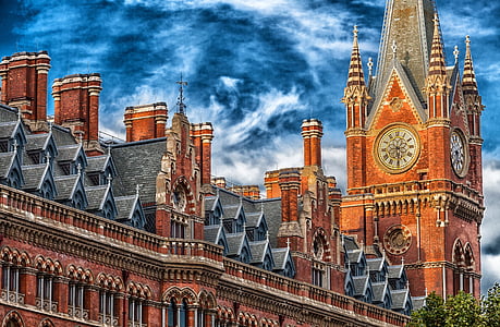 photo of brown and gray brick building during daytime thumbnail