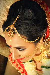 woman wearing gold-colored head necklaces thumbnail