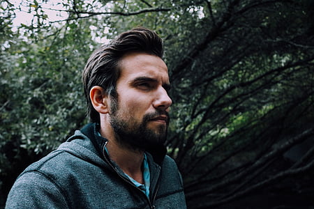 man wears gray zip-up jacket at daytime thumbnail