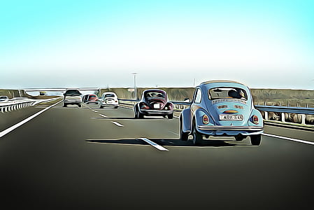 three Volkswagen Beetle coupes on road thumbnail