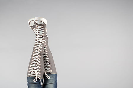person wearing gray cal-high lace sneakers thumbnail