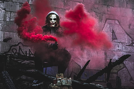 The Joker holding smoke grenade thumbnail