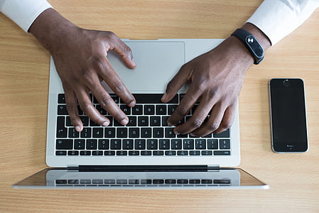 person holding MacBook thumbnail