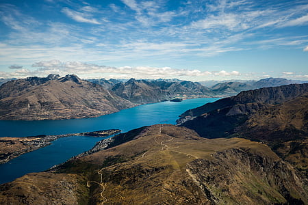 aerial view of body of water between mountains thumbnail