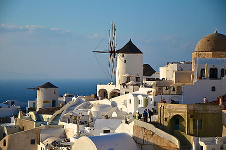 white and brown concrete houses and buildings under blue sky thumbnail