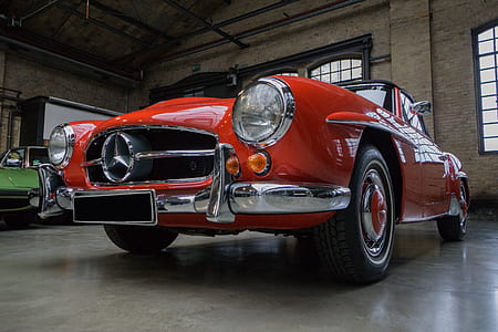 red Mercedes-Benz coupe inside concrete building thumbnail