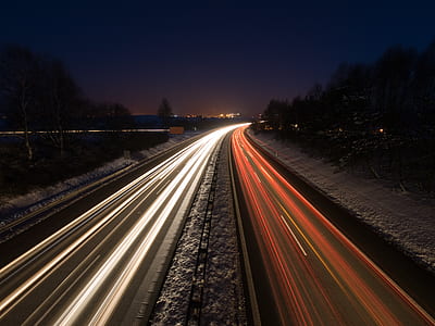 time lapse photography of running vehicles during night time thumbnail