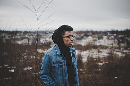 man standing on open filed thumbnail
