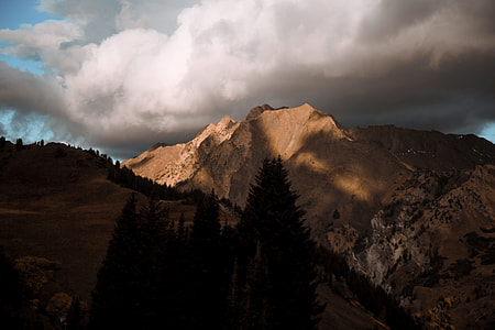 brown rock formation under white sky photography thumbnail