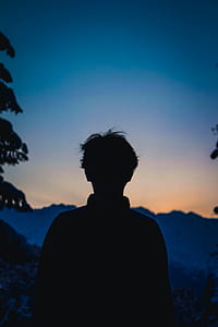 man standing under blue sky thumbnail