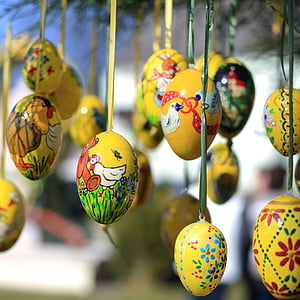 close-up photography of multicolored hanging eggs thumbnail