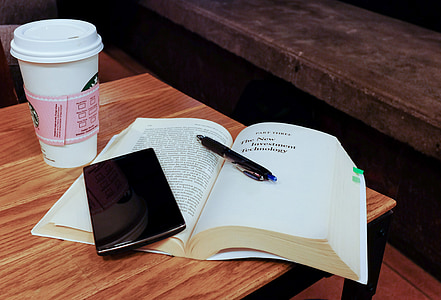 open book and black smartphone thumbnail