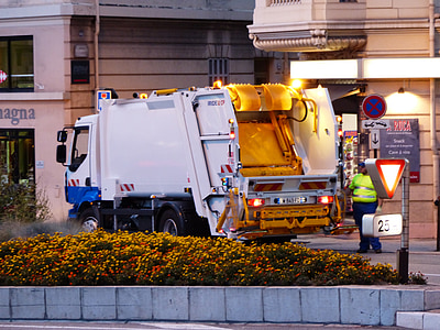 white garbage truck on street thumbnail