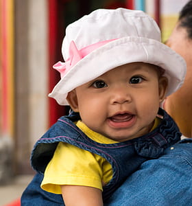 baby wearing pink hat thumbnail