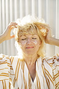 Woman in White and Brown Pinstriped Top thumbnail