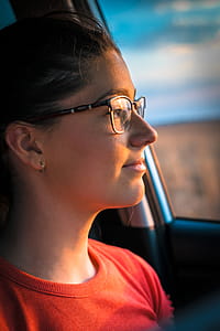 Woman in Orange Crew-neck Top Near Car Door thumbnail