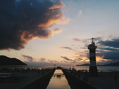 people standing near body of water thumbnail