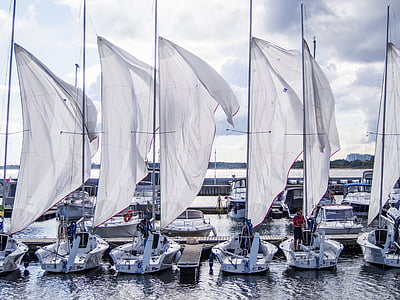 white powerboats in front of dock station thumbnail